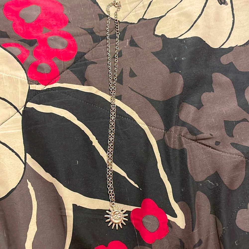 Silver sun and moon necklace